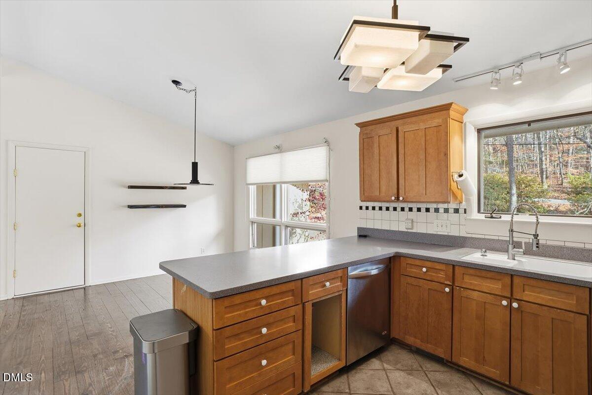 620 Sugarberry Road Chapel Hill, NC 27514 - Photo 17 of 33 a kitchen with a sink cabinets and window