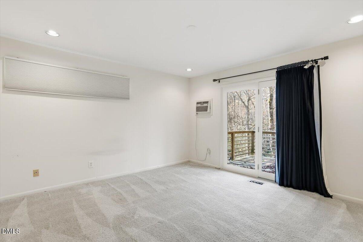 620 Sugarberry Road Chapel Hill, NC 27514 - Photo 19 of 33 a view of an empty room with a window