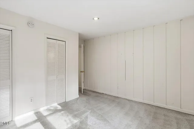 a view of a balcony with wooden floor and fence