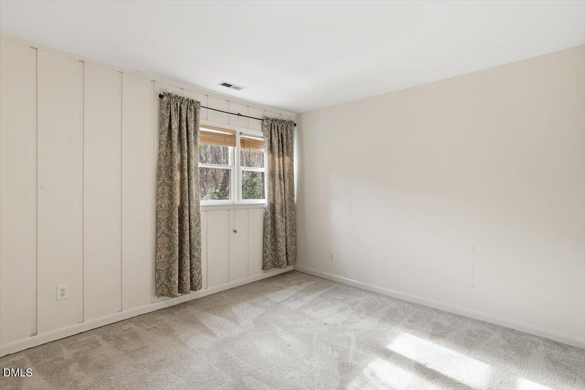 620 Sugarberry Road Chapel Hill, NC 27514 - Photo 27 of 33 a view of an empty room with a window