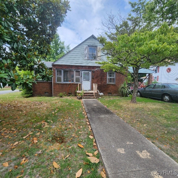 View of front of house with a front yard