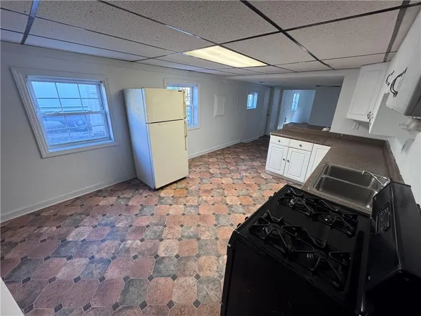 a kitchen with a stove and a refrigerator