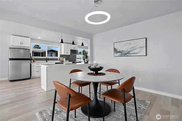 a view of a dining room with furniture and wooden floor