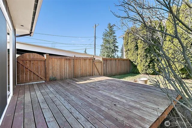 a view of outdoor space with wooden deck
