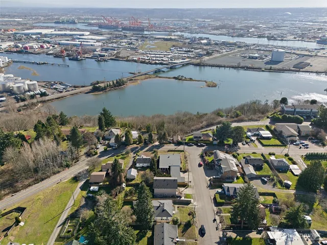 an aerial view of a city with a lake view