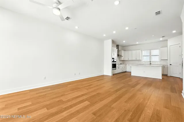 a view of kitchen with wooden floor