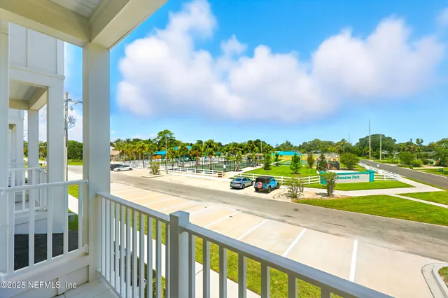 a view of a city street from a balcony