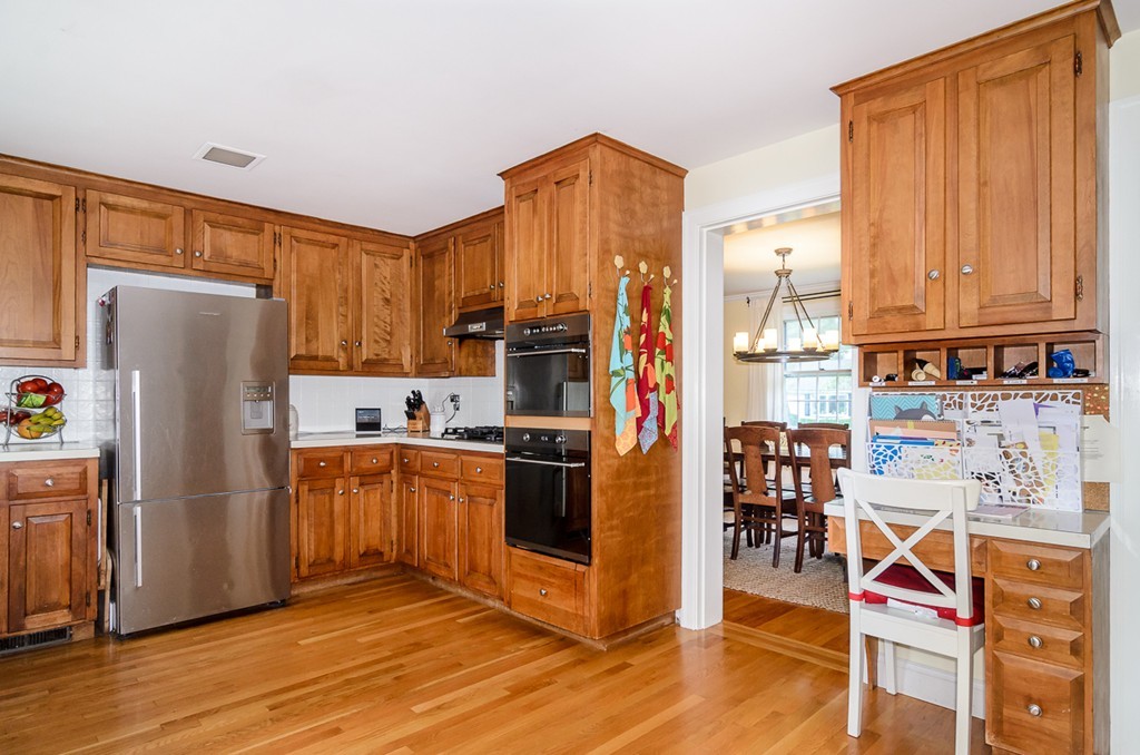 31 Haven Road Wellesley, MA 02481 - Photo 4 of 22 a kitchen with stainless steel appliances a refrigerator and a stove top oven