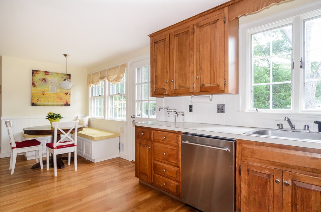 31 Haven Road Wellesley, MA 02481 - Photo 5 of 22 a kitchen with a sink and wooden cabinets