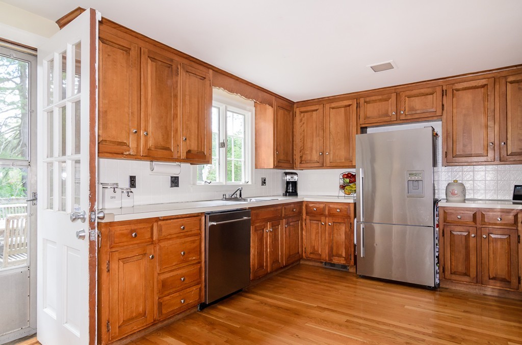 31 Haven Road Wellesley, MA 02481 - Photo 6 of 22 a kitchen with stainless steel appliances granite countertop a refrigerator sink and cabinets