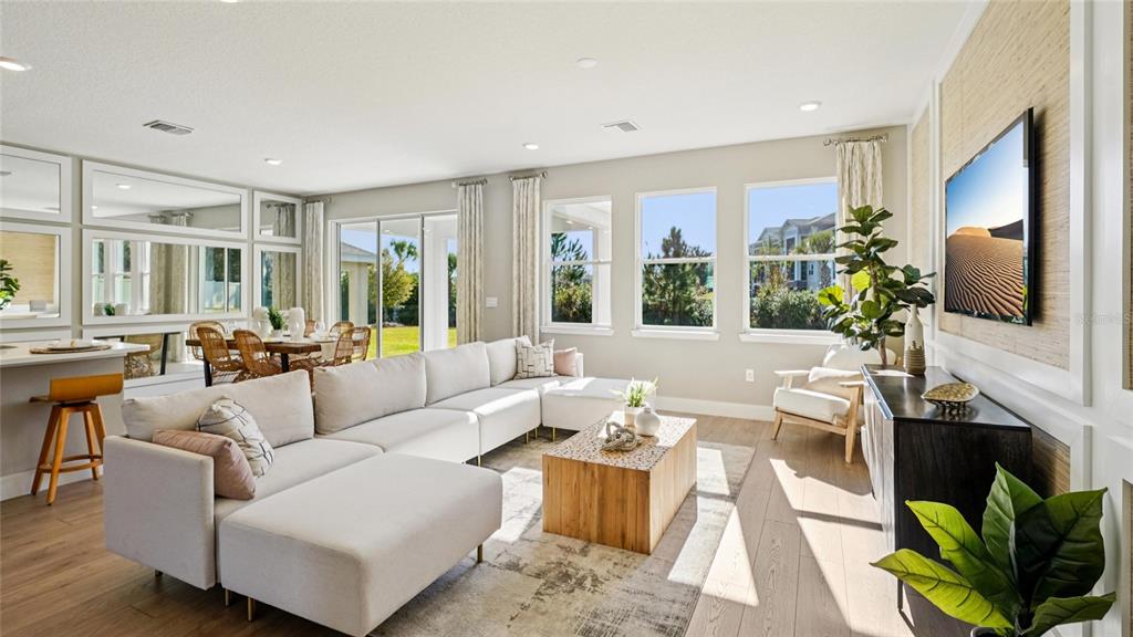 4265 Southwest 52nd Lane Road Ocala, FL 34474 - Photo 12 of 40 a living room with fireplace furniture and a flat screen tv