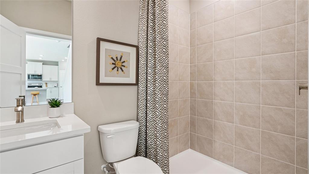 4265 Southwest 52nd Lane Road Ocala, FL 34474 - Photo 17 of 40 a bathroom with a toilet sink and mirror