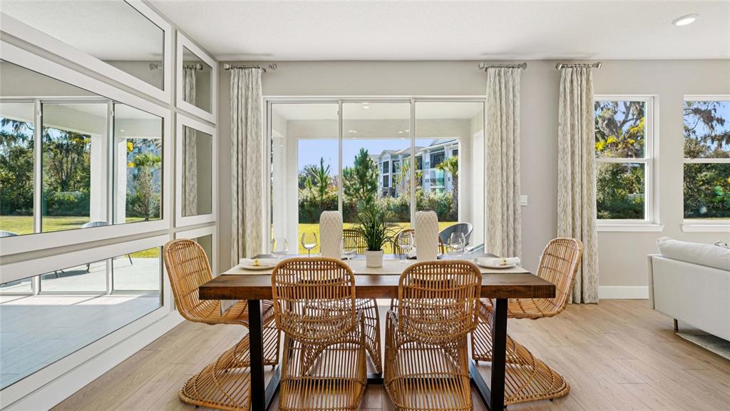 4265 Southwest 52nd Lane Road Ocala, FL 34474 - Photo 9 of 40 a view of a dining room with furniture window and outside view