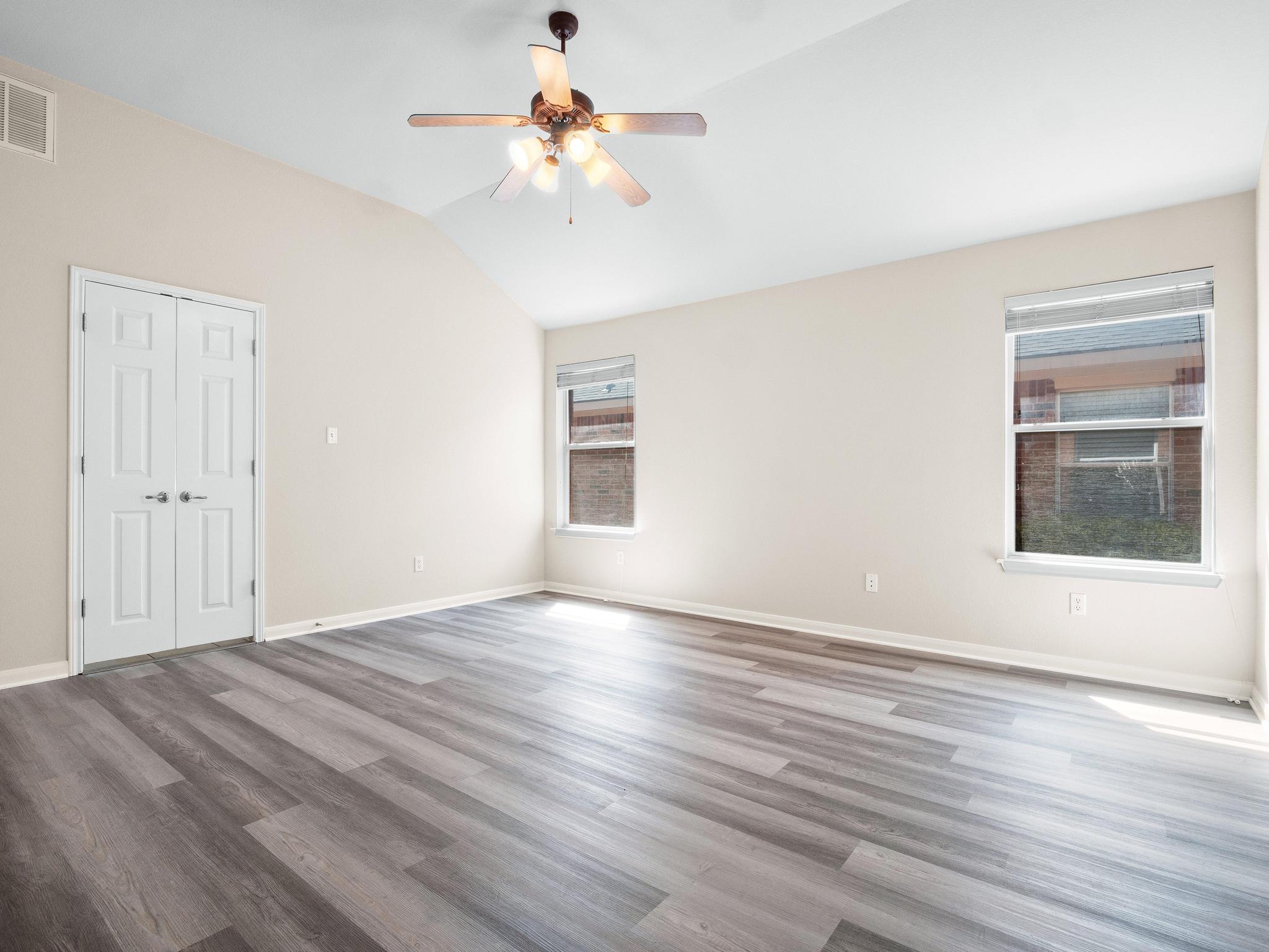 429 Falcon Lane Leander, TX 78641 - Photo 15 of 27 wooden floor in an empty room with a window
