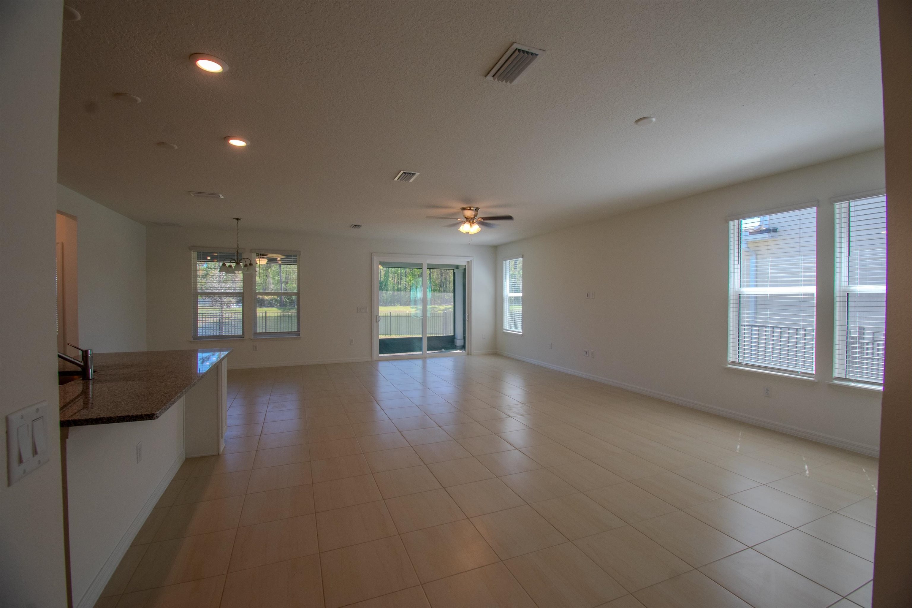 436 Cedar Preserve Ln Street St. Augustine, FL 32095 - Photo 11 of 27 a view of empty room with wooden floor and fan