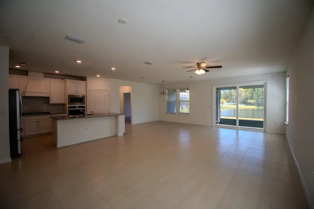 a view of kitchen with furniture and window