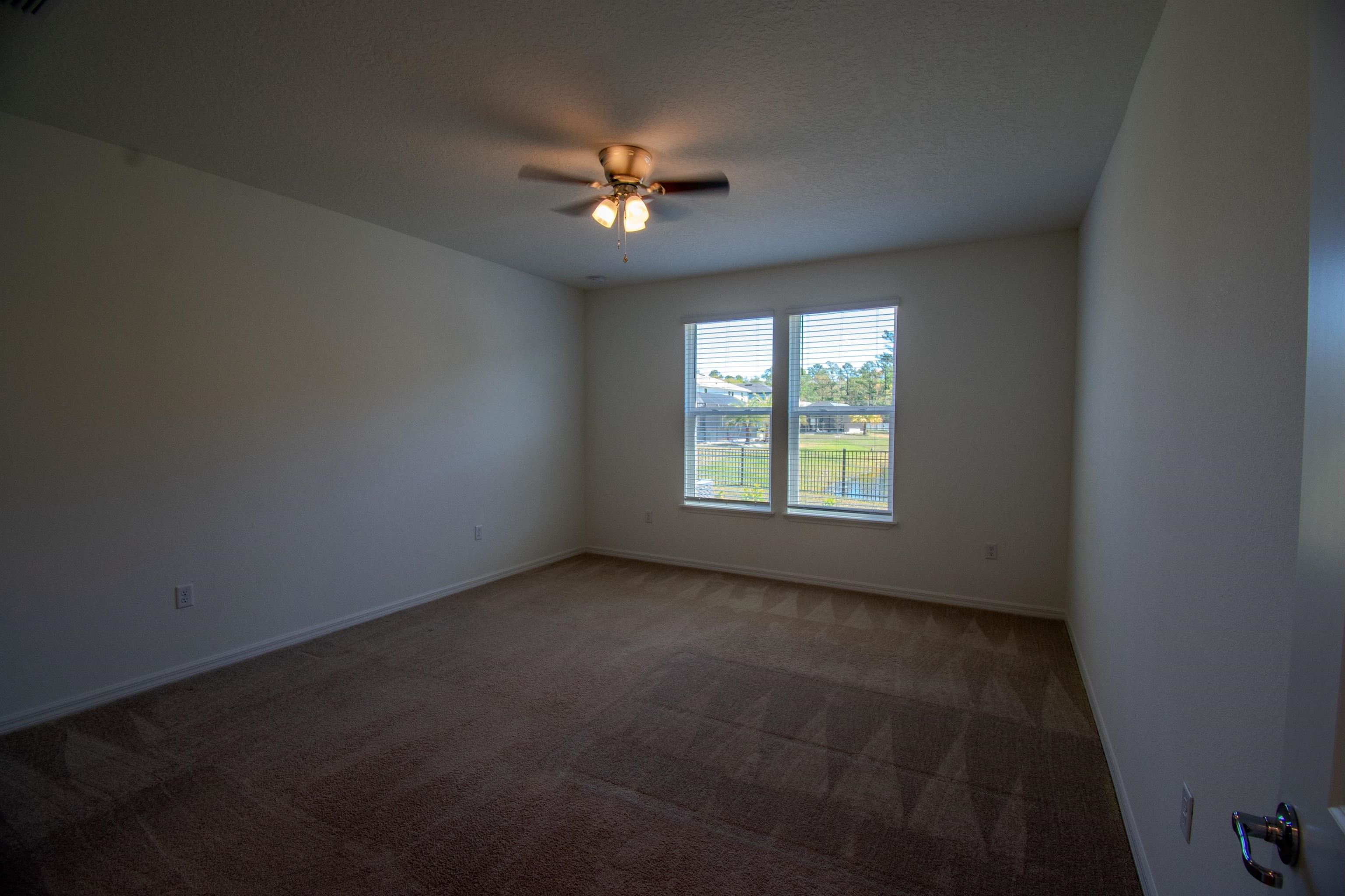 436 Cedar Preserve Ln Street St. Augustine, FL 32095 - Photo 18 of 27 a view of an empty room with a window
