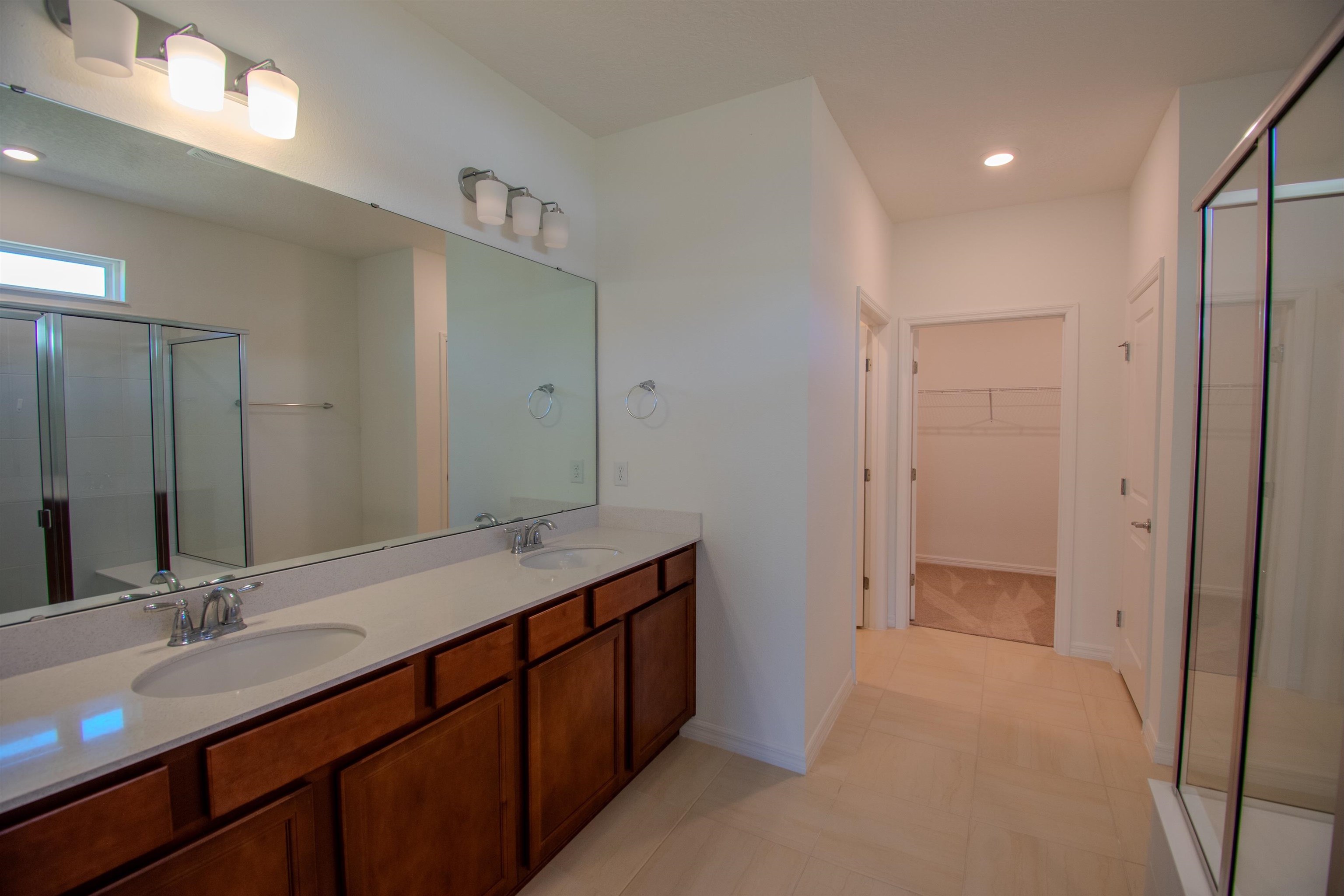 436 Cedar Preserve Ln Street St. Augustine, FL 32095 - Photo 20 of 27 a bathroom with a double vanity sink and a mirror