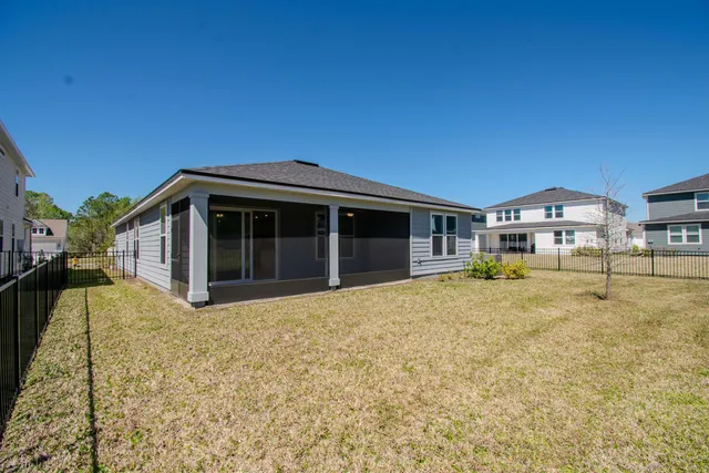 a front view of house with a garden