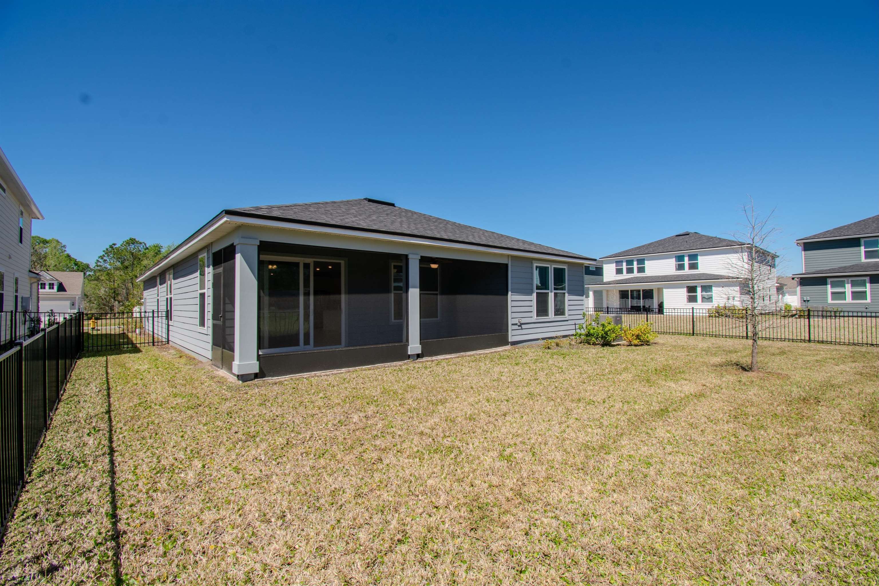 436 Cedar Preserve Ln Street St. Augustine, FL 32095 - Photo 24 of 27 a front view of a house with a garden
