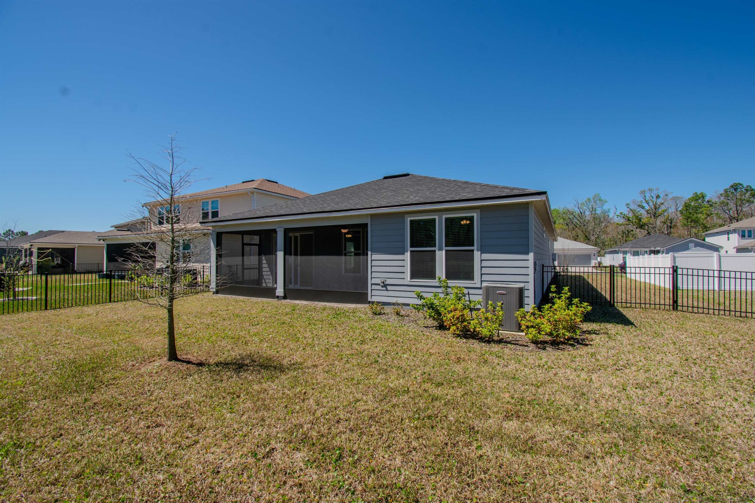 436 Cedar Preserve Ln Street St. Augustine, FL 32095 - Photo 25 of 27 a front view of a house with garden