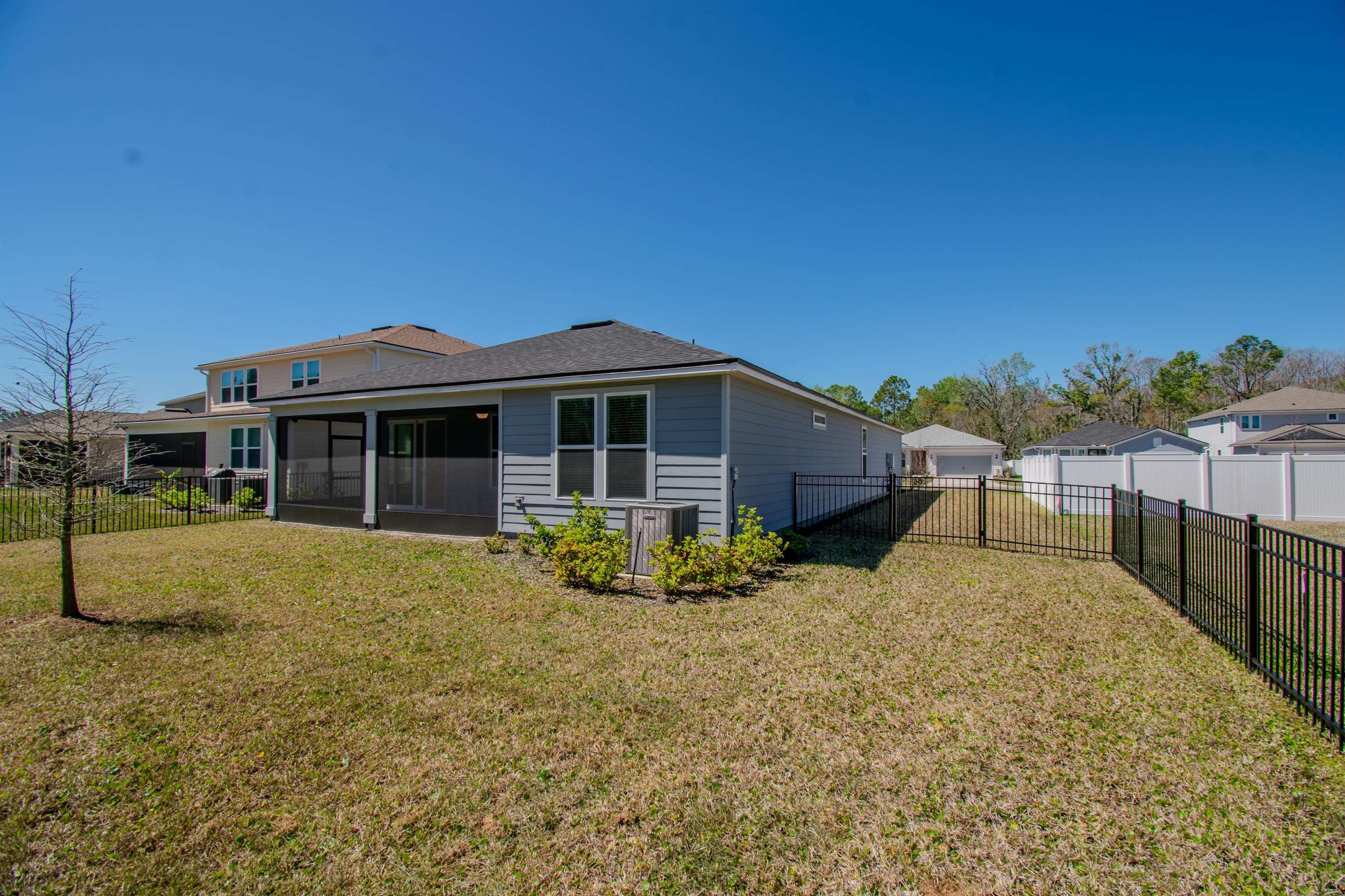 436 Cedar Preserve Ln Street St. Augustine, FL 32095 - Photo 26 of 27 a front view of house with a garden