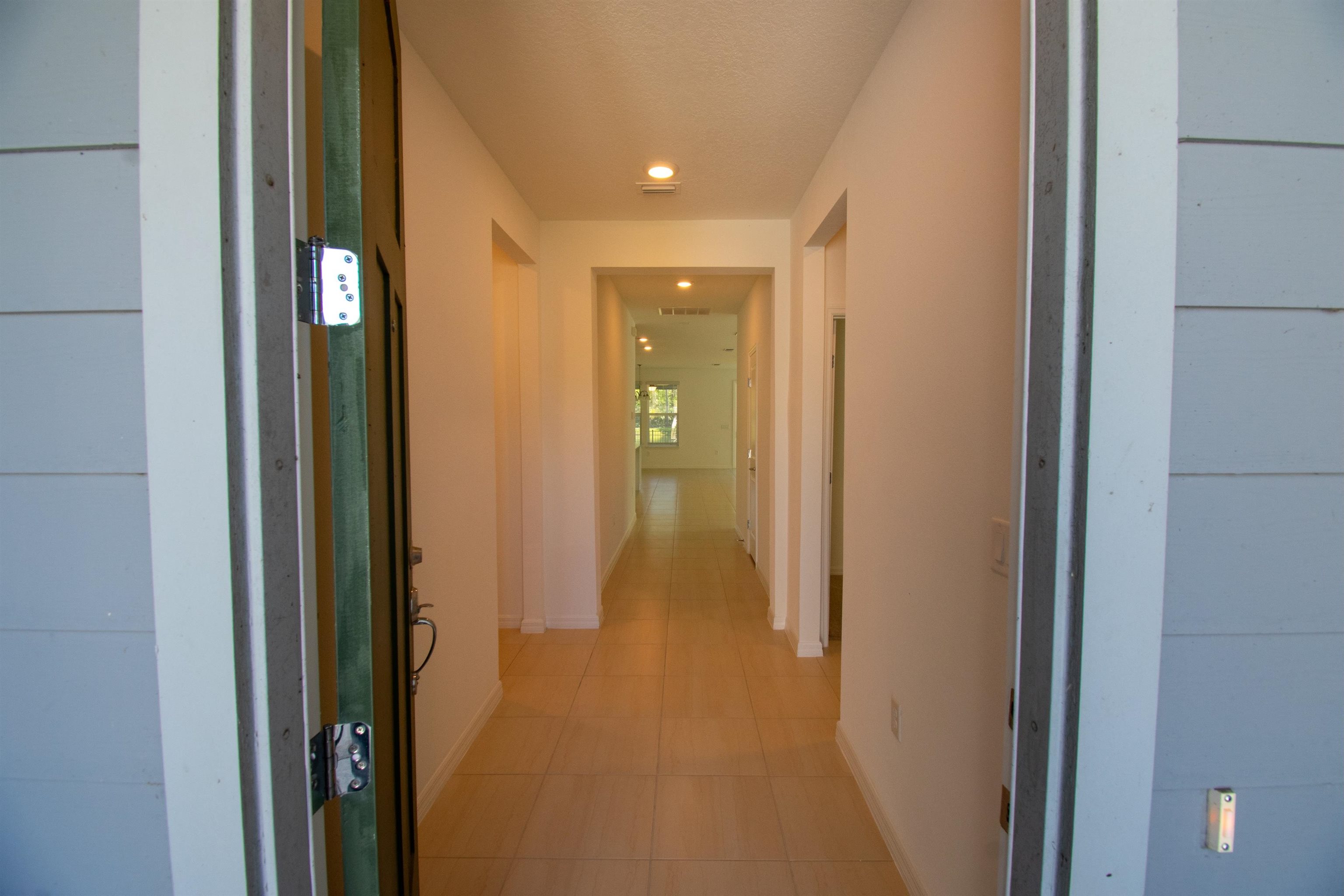 436 Cedar Preserve Ln Street St. Augustine, FL 32095 - Photo 3 of 27 a view of a hallway with wooden floor