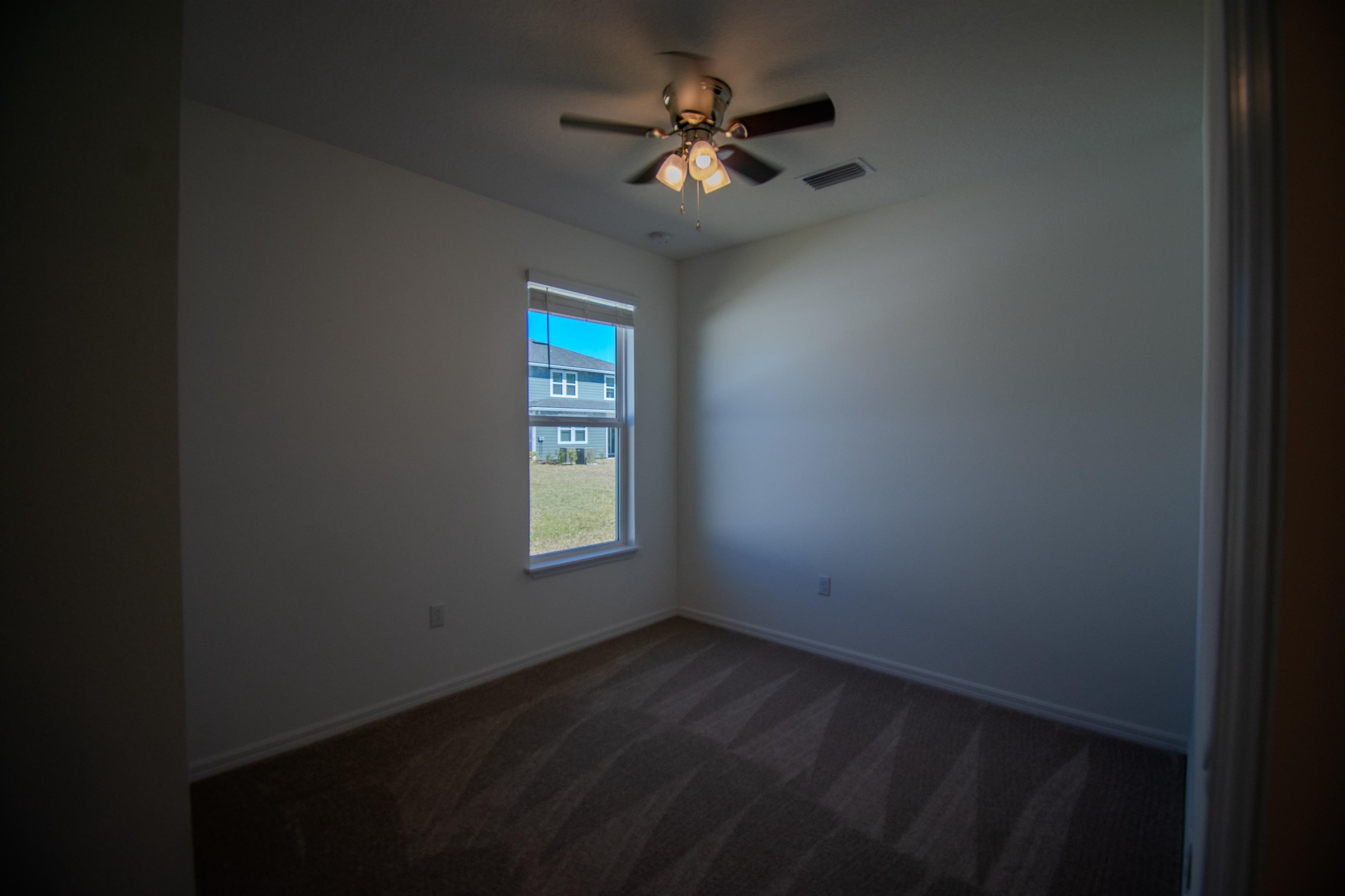 436 Cedar Preserve Ln Street St. Augustine, FL 32095 - Photo 9 of 27 a view of an empty room with a window