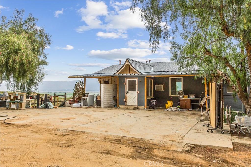 23255 Warren Road San Jacinto, CA 92582 - Photo 12 of 56 a view of a house with snow on the side of the road