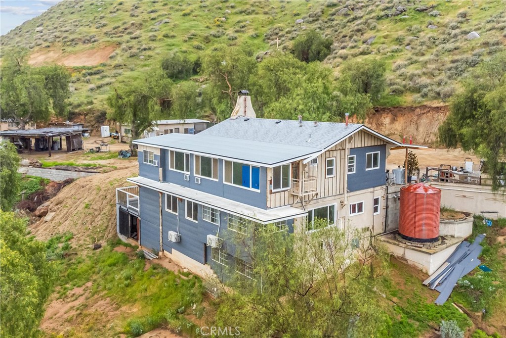 23255 Warren Road San Jacinto, CA 92582 - Photo 13 of 56 an aerial view of residential house with outdoor space and trees around