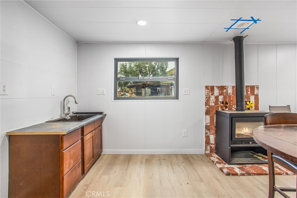 23255 Warren Road San Jacinto, CA 92582 - Photo 16 of 56 a kitchen with a sink and a stove top oven