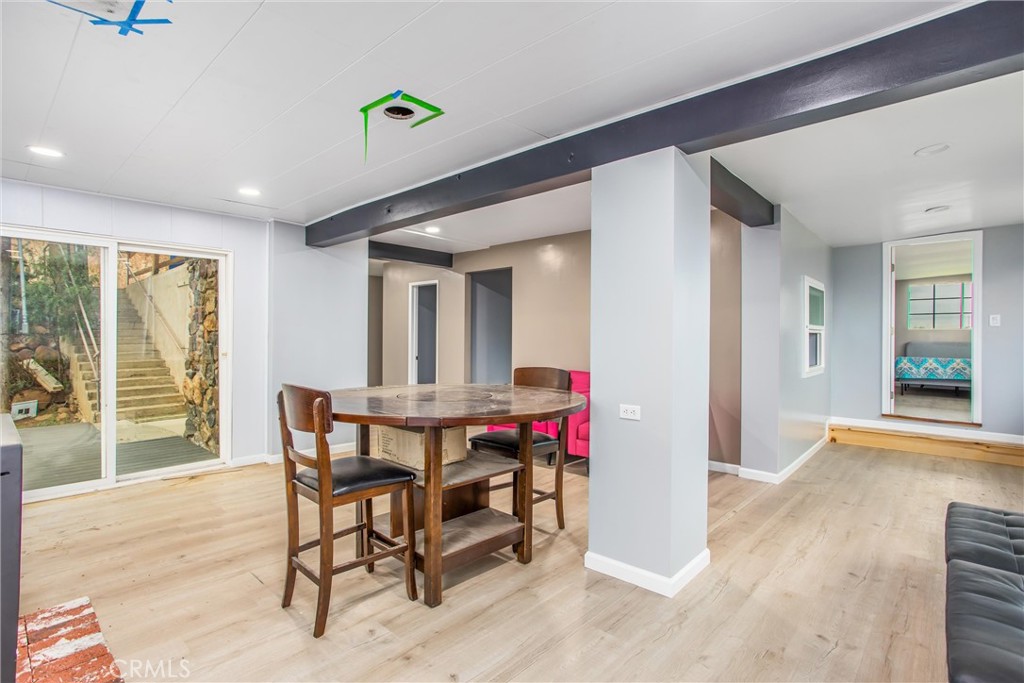 23255 Warren Road San Jacinto, CA 92582 - Photo 17 of 56 a view of a dining room with furniture window and wooden floor