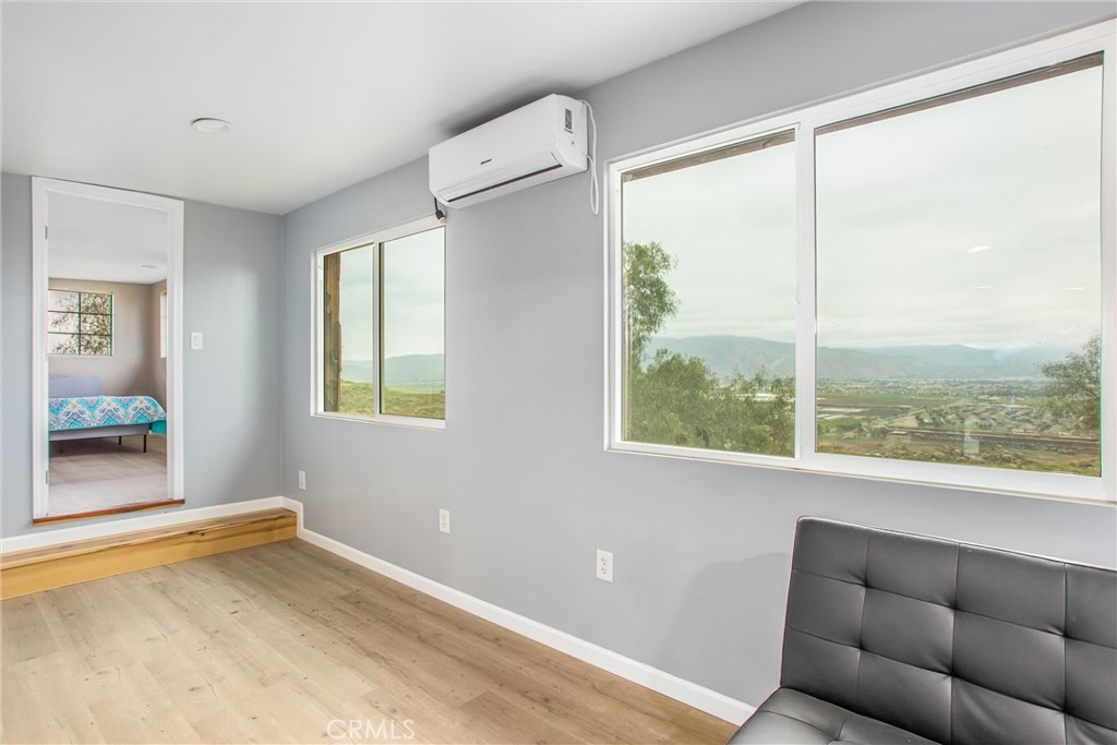 23255 Warren Road San Jacinto, CA 92582 - Photo 18 of 56 a living room with furniture and a window