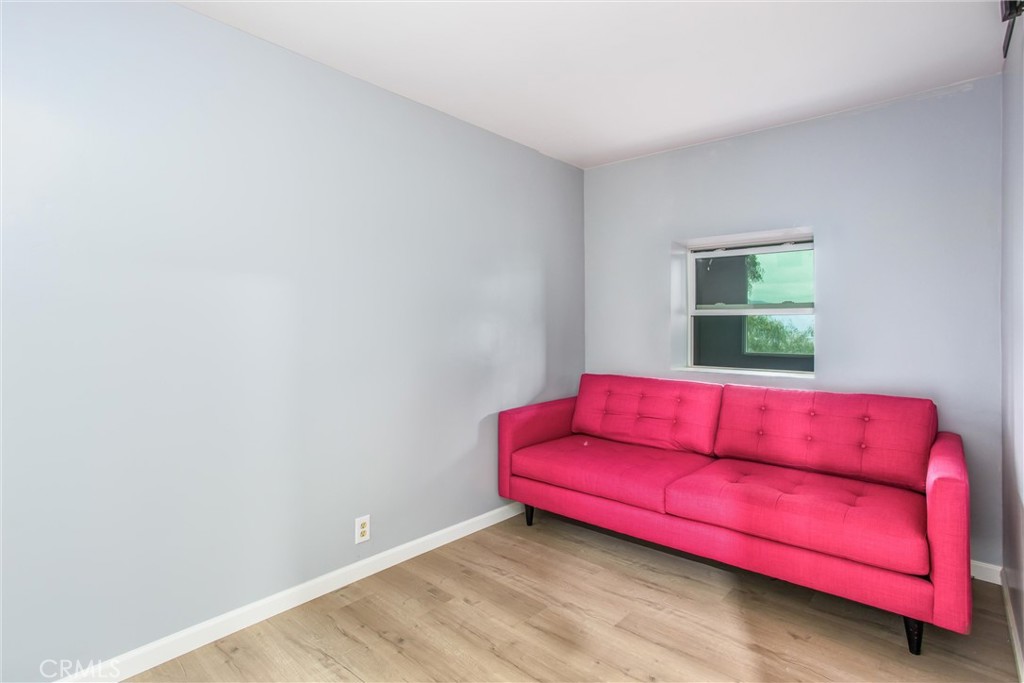 23255 Warren Road San Jacinto, CA 92582 - Photo 20 of 56 a living room with red couch