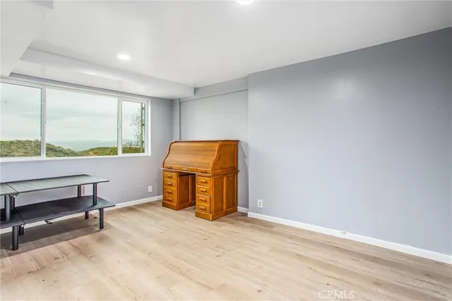 a view of a balcony with wooden floor