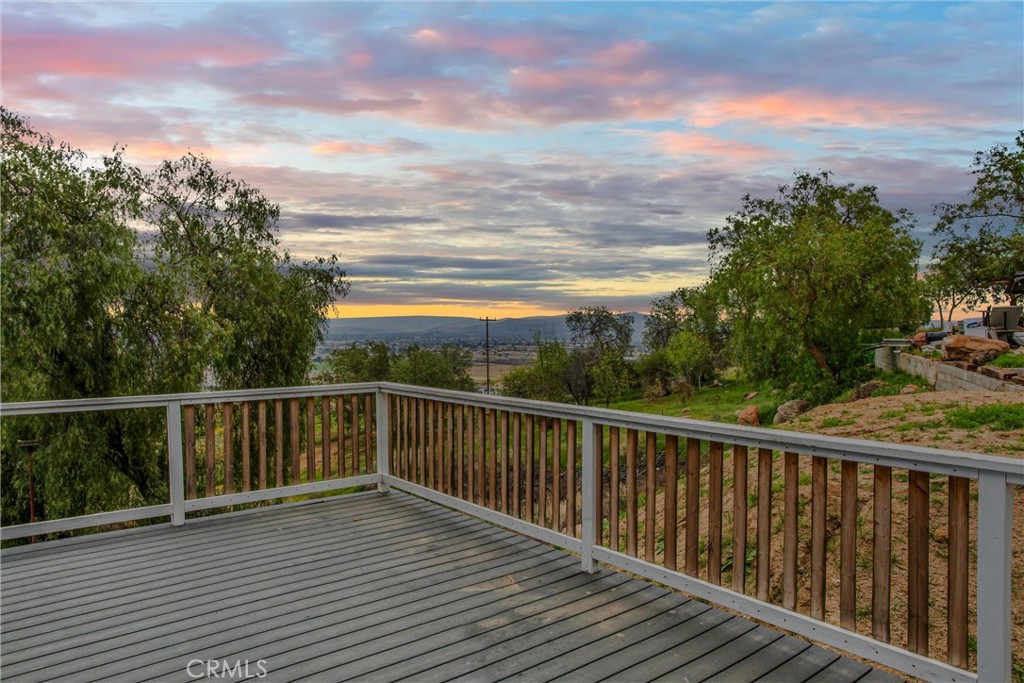 23255 Warren Road San Jacinto, CA 92582 - Photo 28 of 56 a view of a balcony with wooden floor and fence