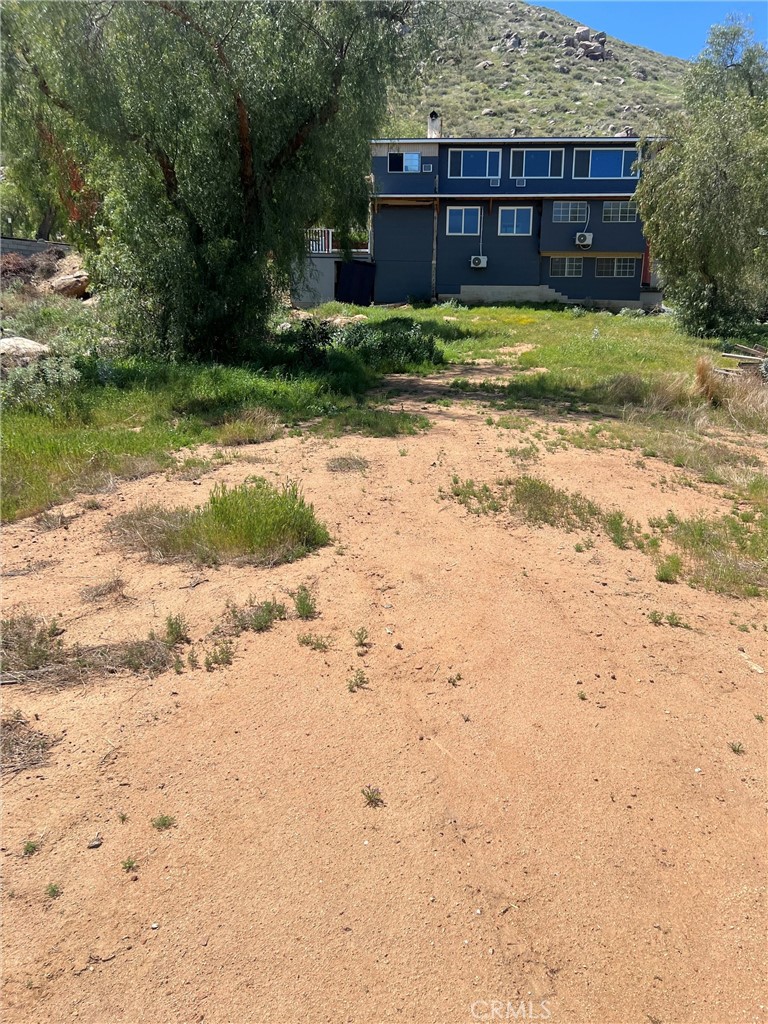 23255 Warren Road San Jacinto, CA 92582 - Photo 51 of 56 a view of a house with a yard