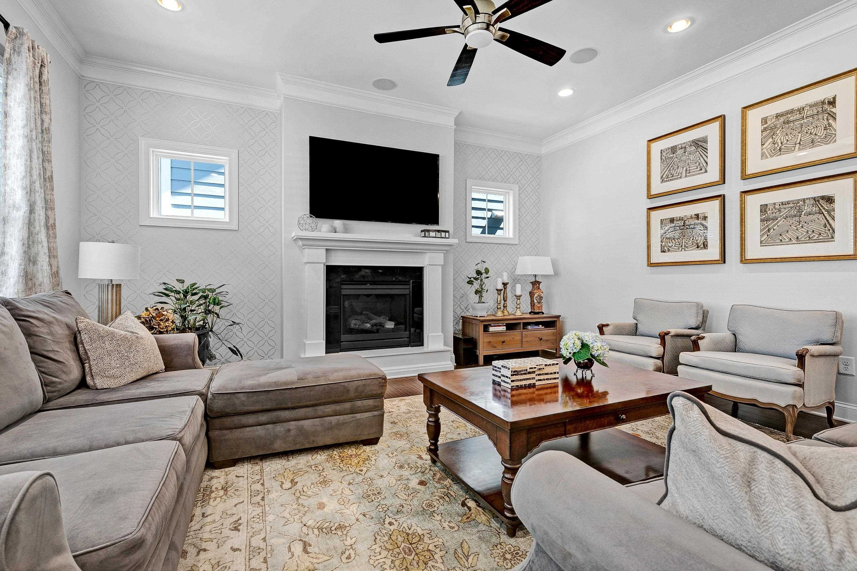 1529 Fullerton Place Raleigh, NC 27607 - Photo 14 of 53 a living room with furniture a flat screen tv and a fireplace