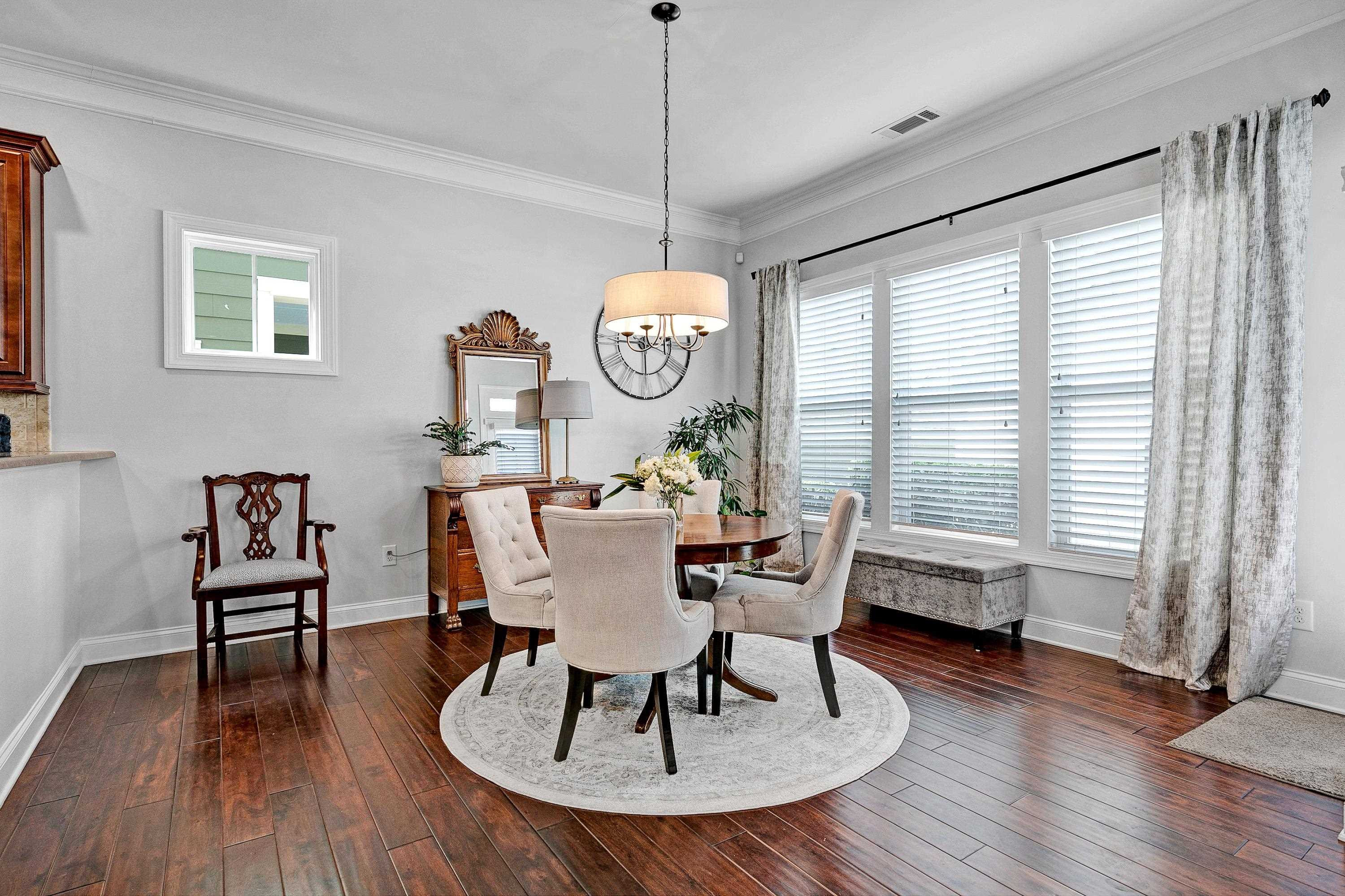 1529 Fullerton Place Raleigh, NC 27607 - Photo 22 of 53 a dining room with furniture window wooden floor