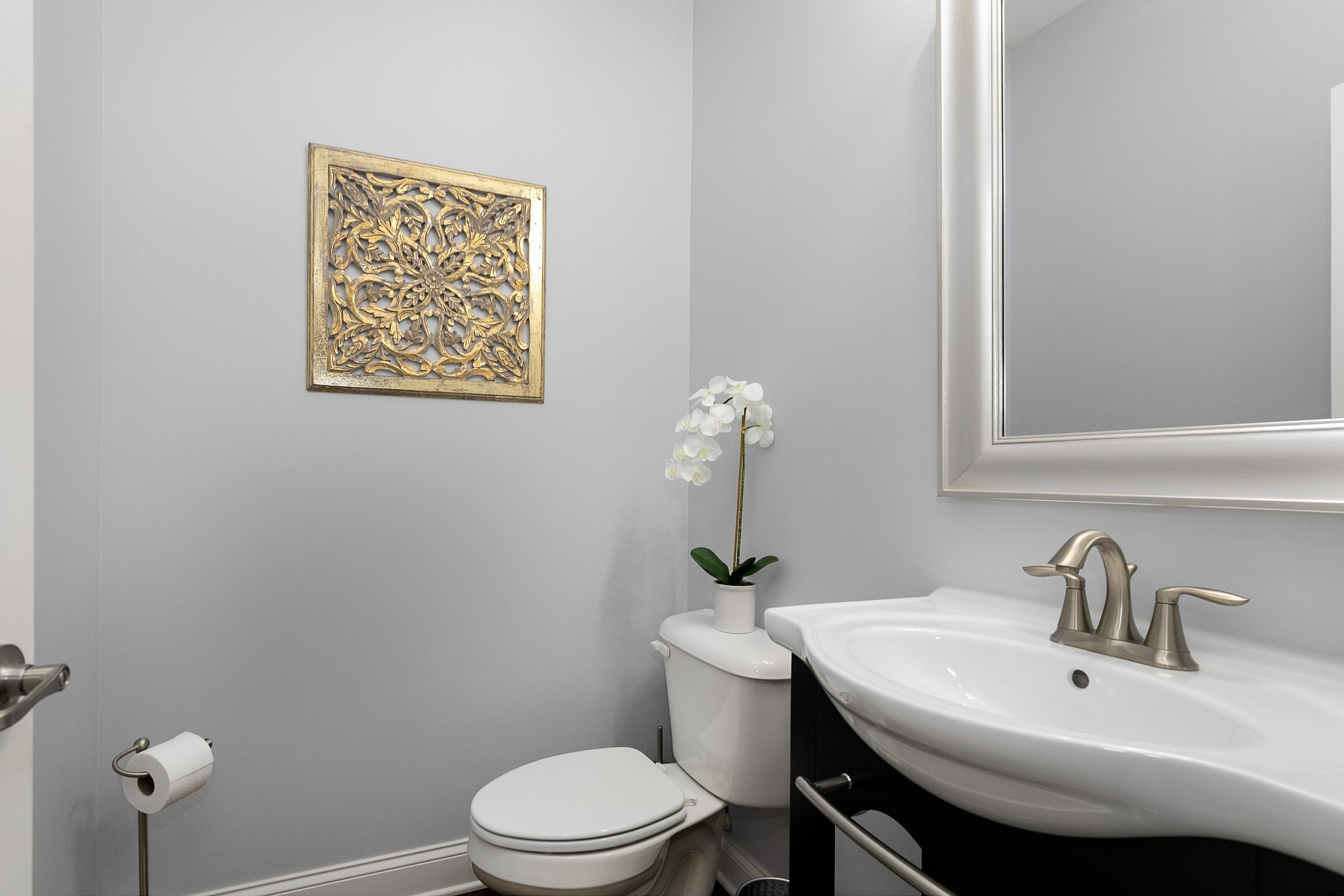1529 Fullerton Place Raleigh, NC 27607 - Photo 24 of 53 a bathroom with a sink a toilet and mirror
