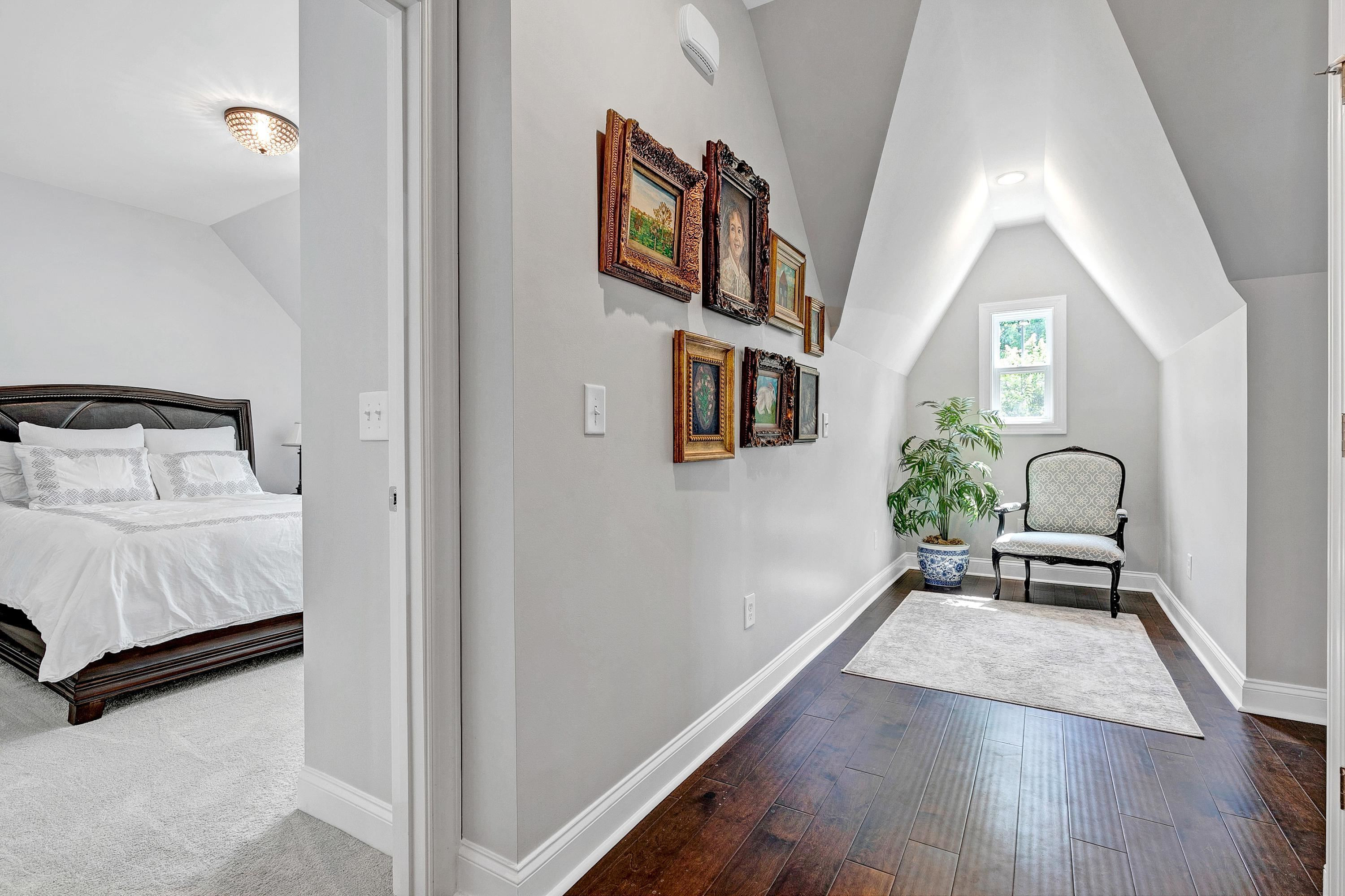 1529 Fullerton Place Raleigh, NC 27607 - Photo 25 of 53 a hallway with a book shelf and wooden floor