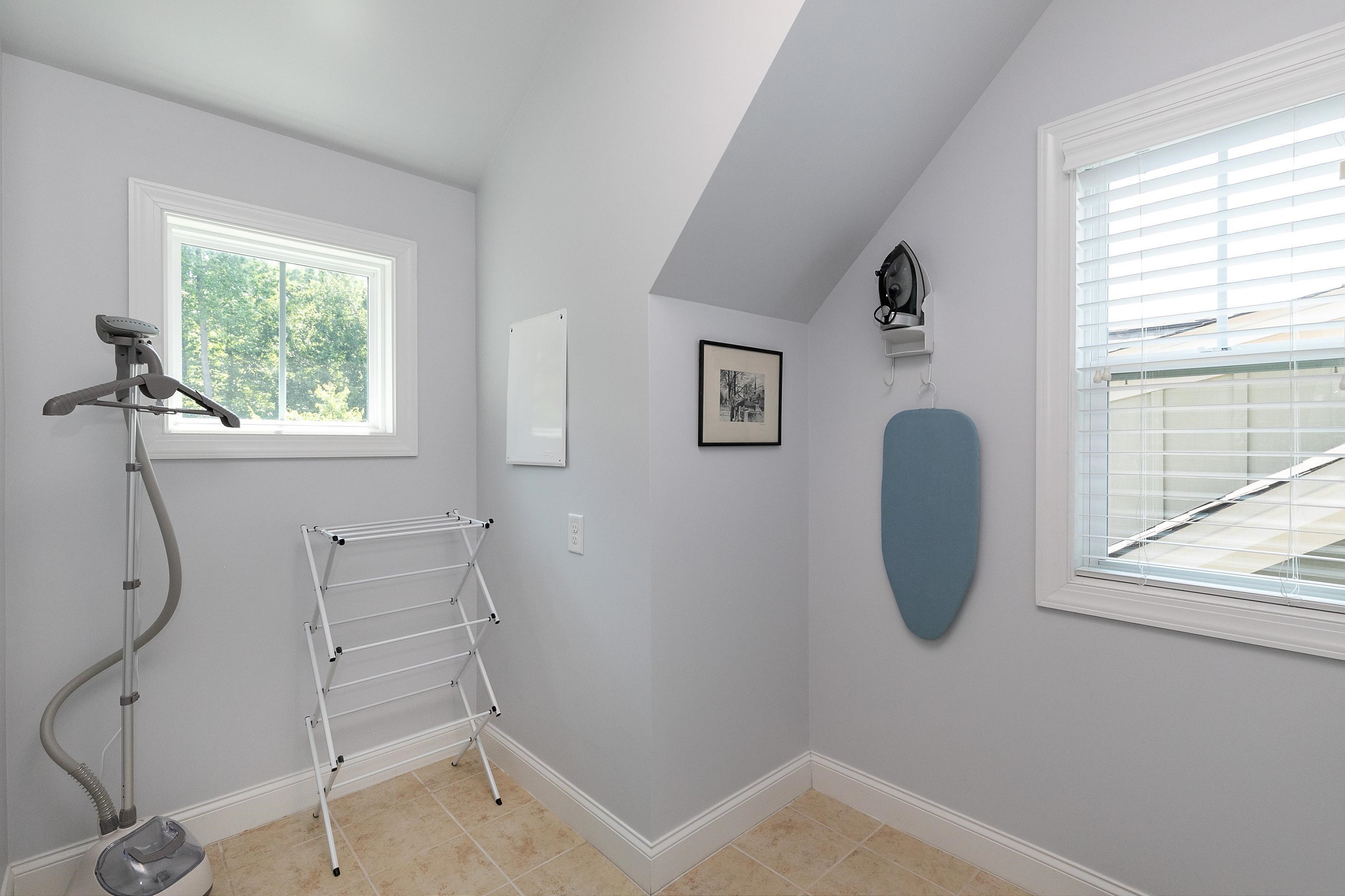 1529 Fullerton Place Raleigh, NC 27607 - Photo 35 of 53 a room with a window and a chair