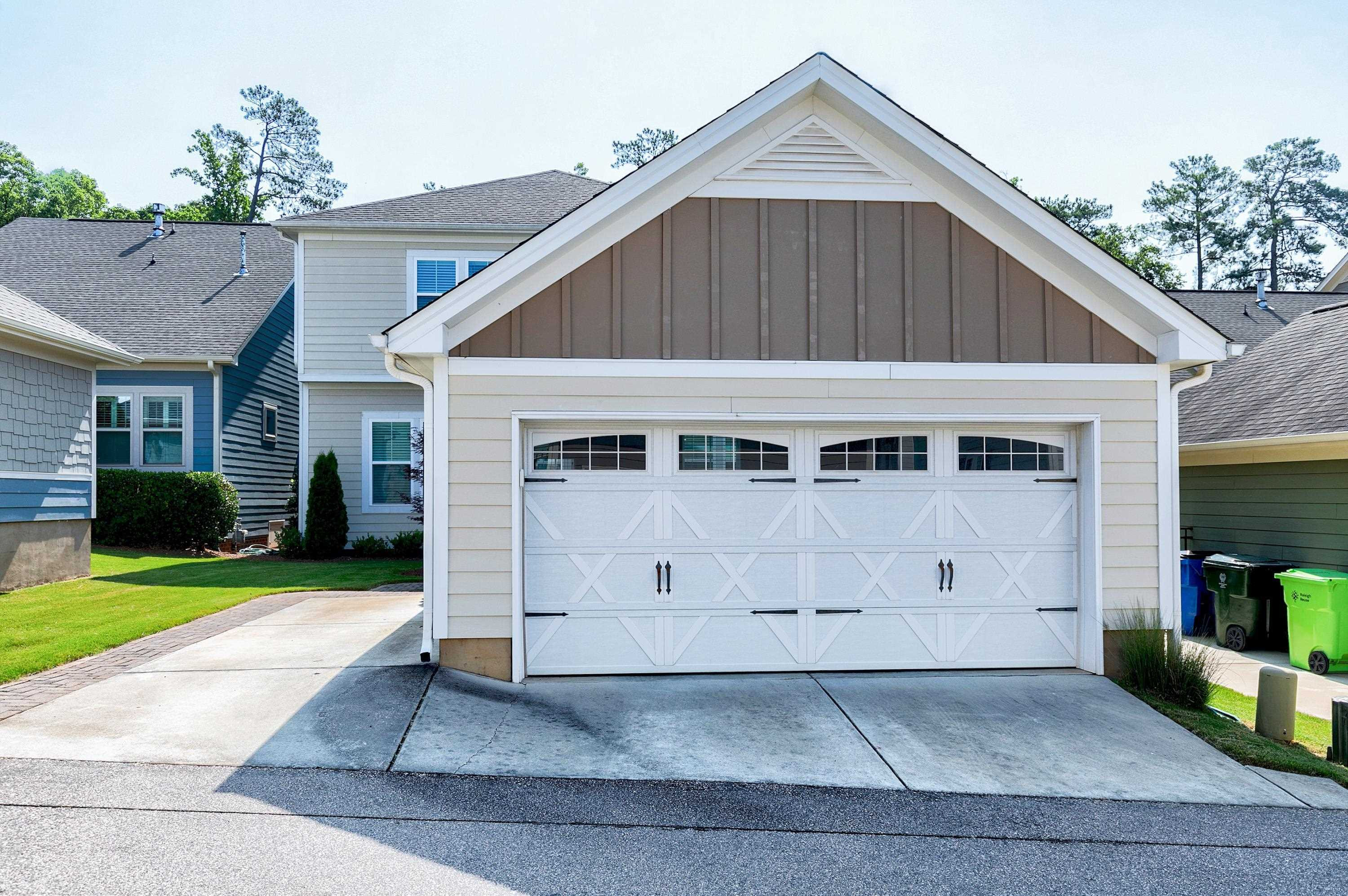 1529 Fullerton Place Raleigh, NC 27607 - Photo 41 of 53 a front view of a house with a yard and garage