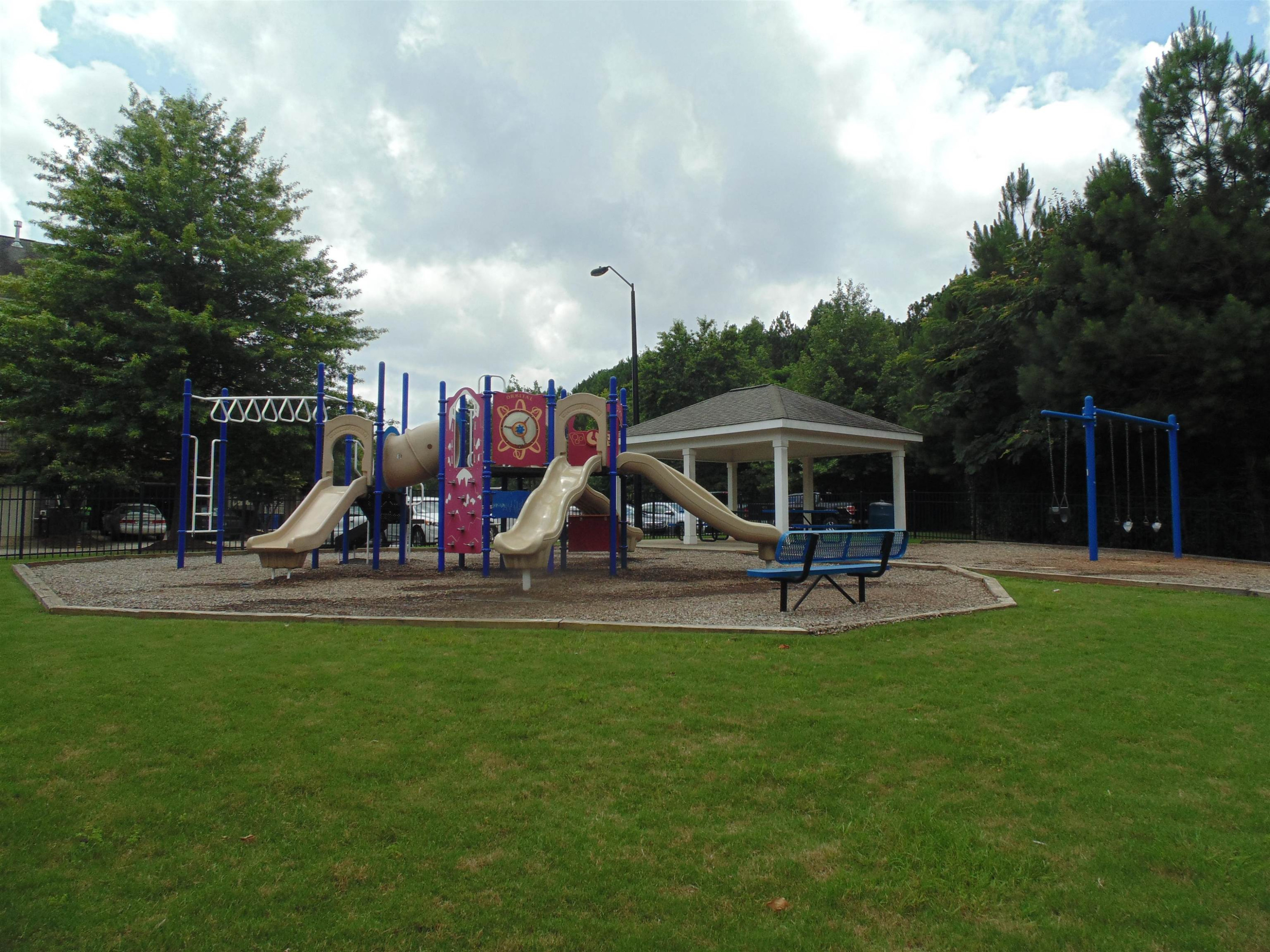 1529 Fullerton Place Raleigh, NC 27607 - Photo 52 of 53 a view of a park with swings and slides