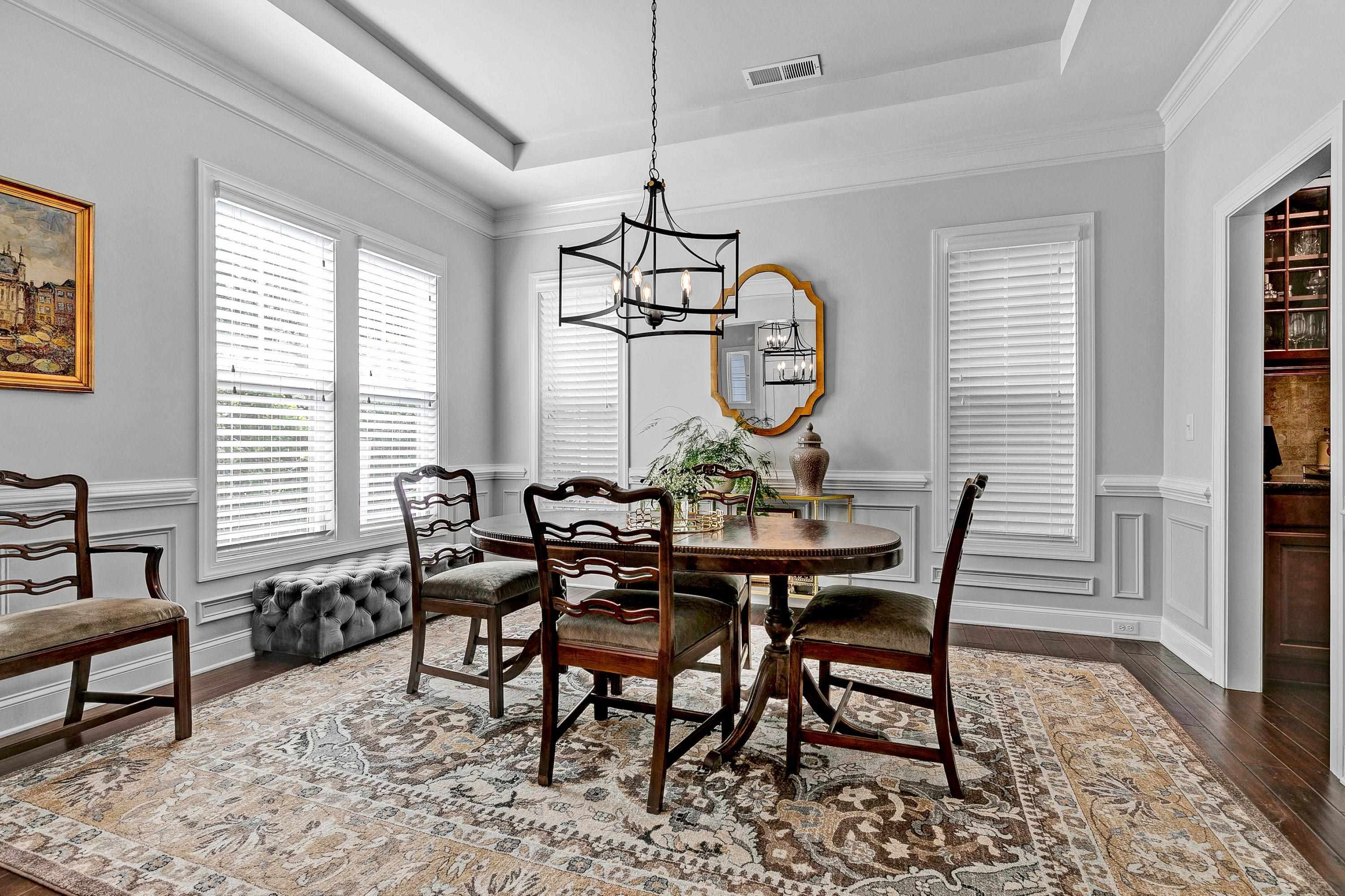 1529 Fullerton Place Raleigh, NC 27607 - Photo 6 of 53 a view of a dining room and livingroom with furniture window and wooden floor