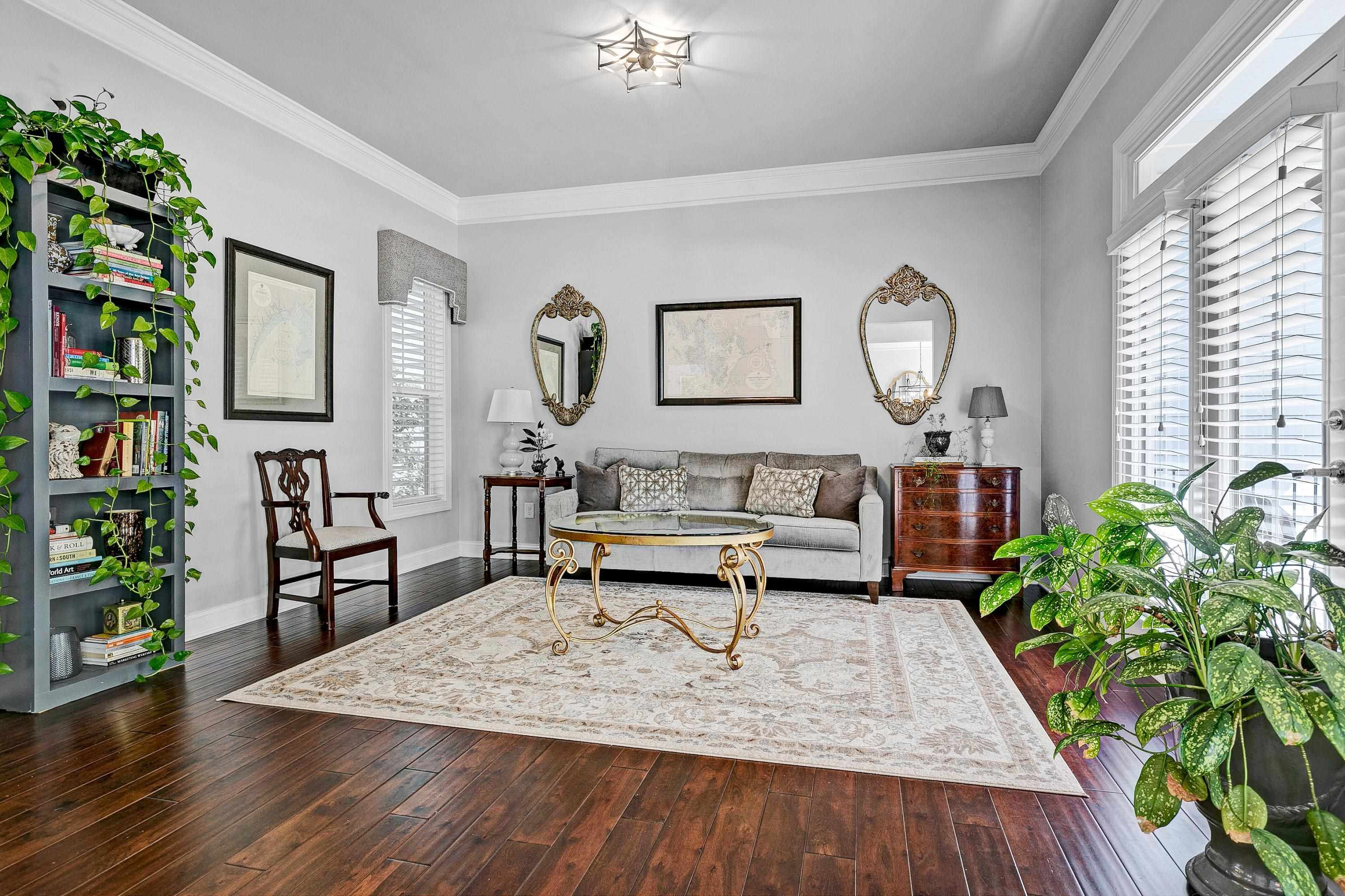 1529 Fullerton Place Raleigh, NC 27607 - Photo 9 of 53 a living room with furniture and a potted plant