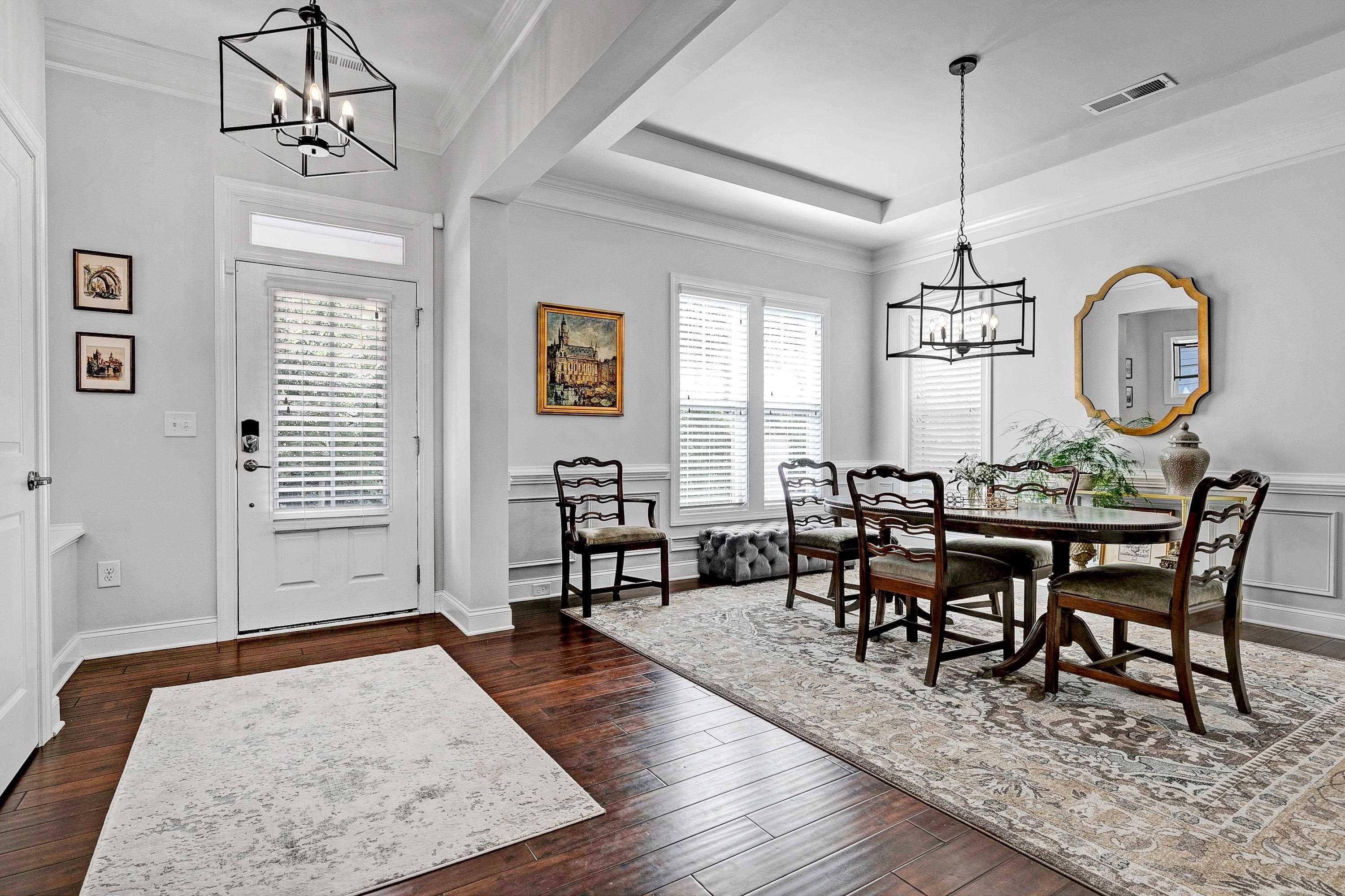 1529 Fullerton Place Raleigh, NC 27607 - Photo 10 of 53 a view of a dining room with furniture window and wooden floor