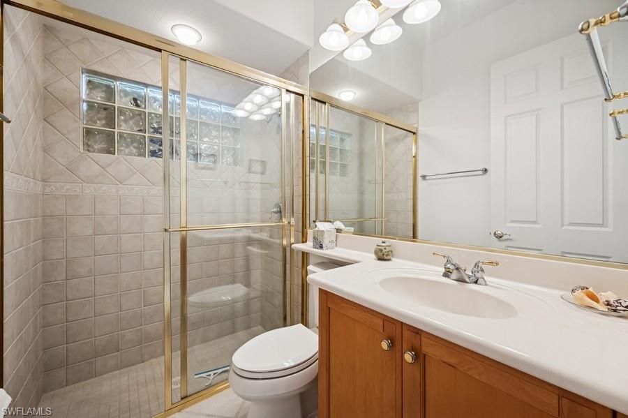 7488 Treeline Drive Naples, FL 34119 - Photo 11 of 22 Full bath featuring vanity and a shower stall