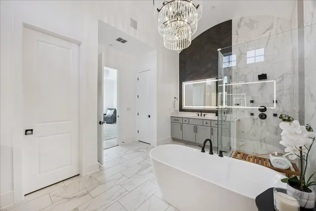 a bathroom with a bathtub and shower