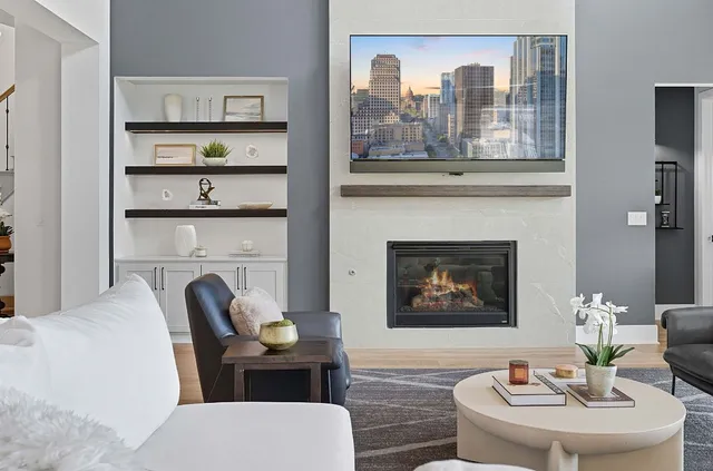 a living room with furniture and a fireplace